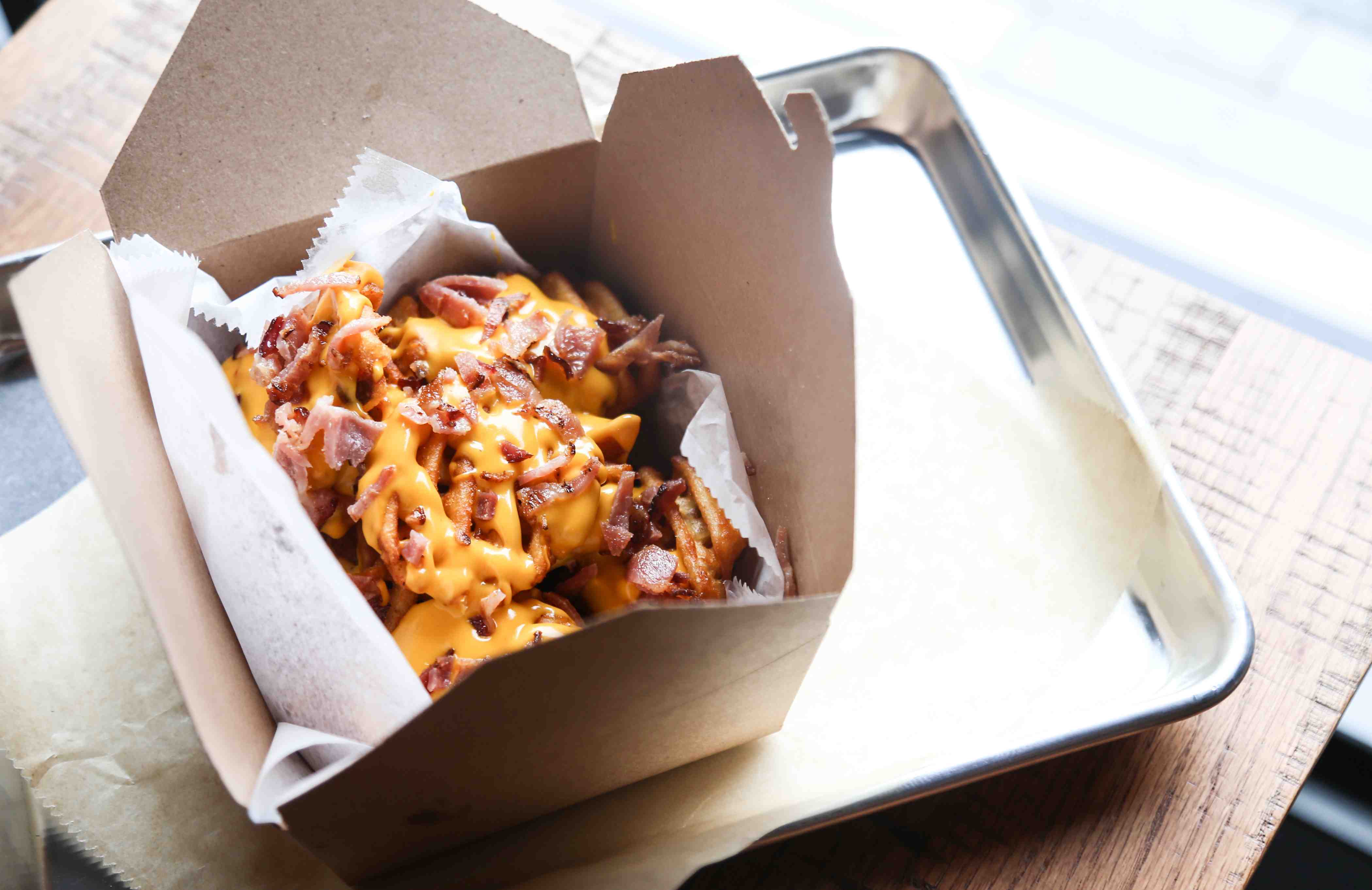 Waffle fries, bacon and nachos with cheese from PZA Pizza in Salem, Mass.