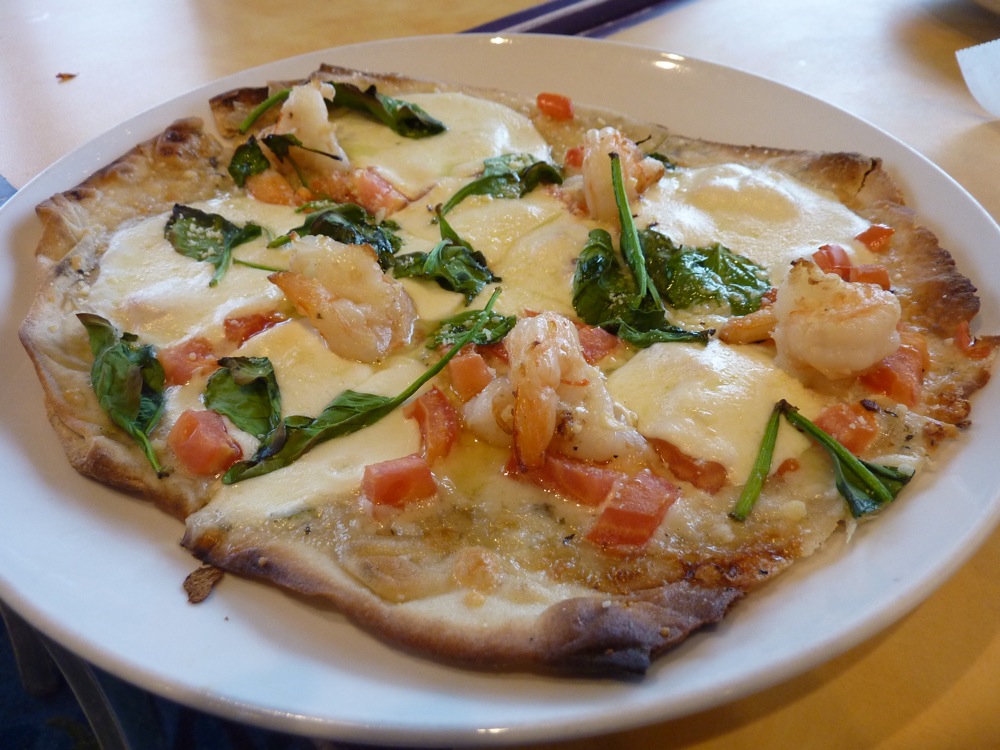 From the CabbyShack in Plymouth MA; flatbread pizza with sauteed shrimp, parmesan, spinach, tomato, fresh mozzarella and garlic spread.