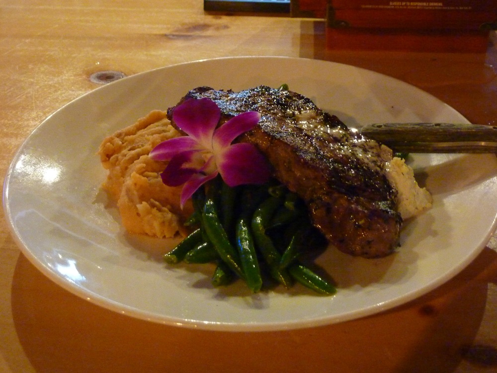 New York center cut sirloin steak with garlic butter, smoked BBQ whiskey mashed potatoes and green beans from The Charred Oak Tavern in Middleboro, Mass.