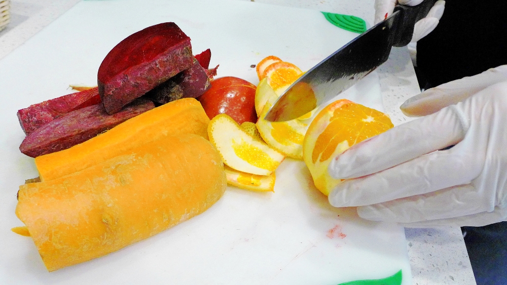 Prepping produce for a smoothie at The Juice Bar in Norwood, MA.