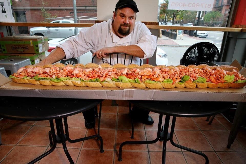 Chef Kevin Dupree showcases a lobster roll from Lobstah On A Roll in Salem and Boston, Mass.