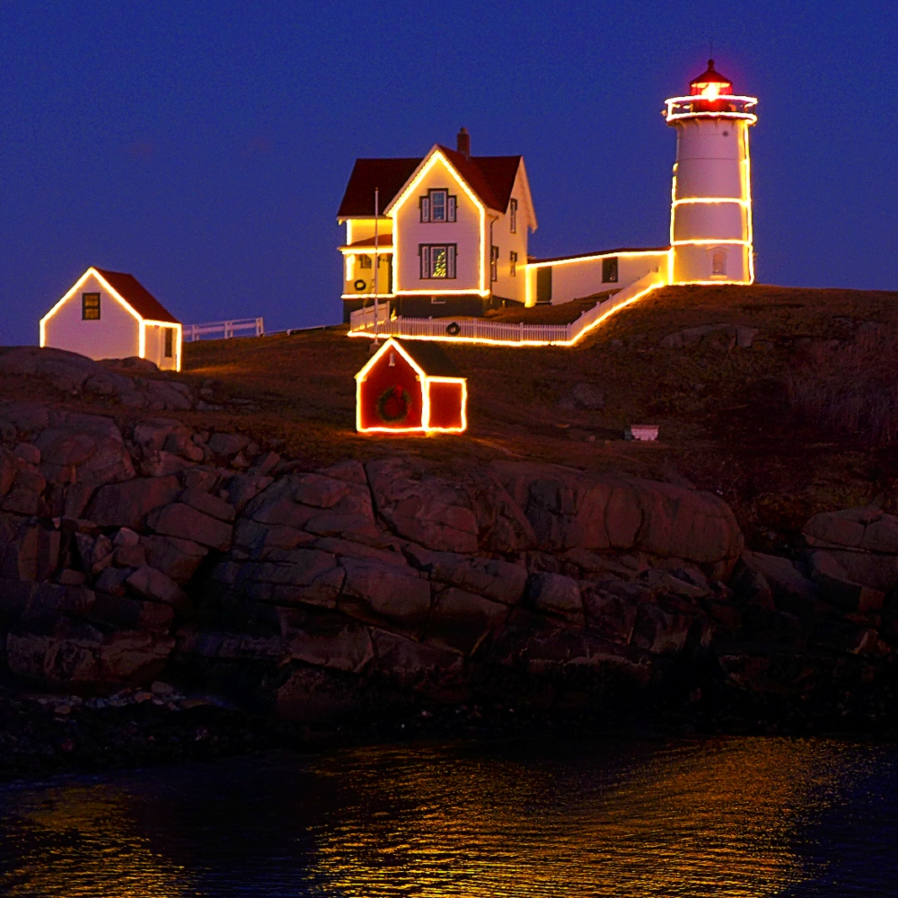 Celebarting Christmas in New England: a lighthouse dressed in Christmas lights.