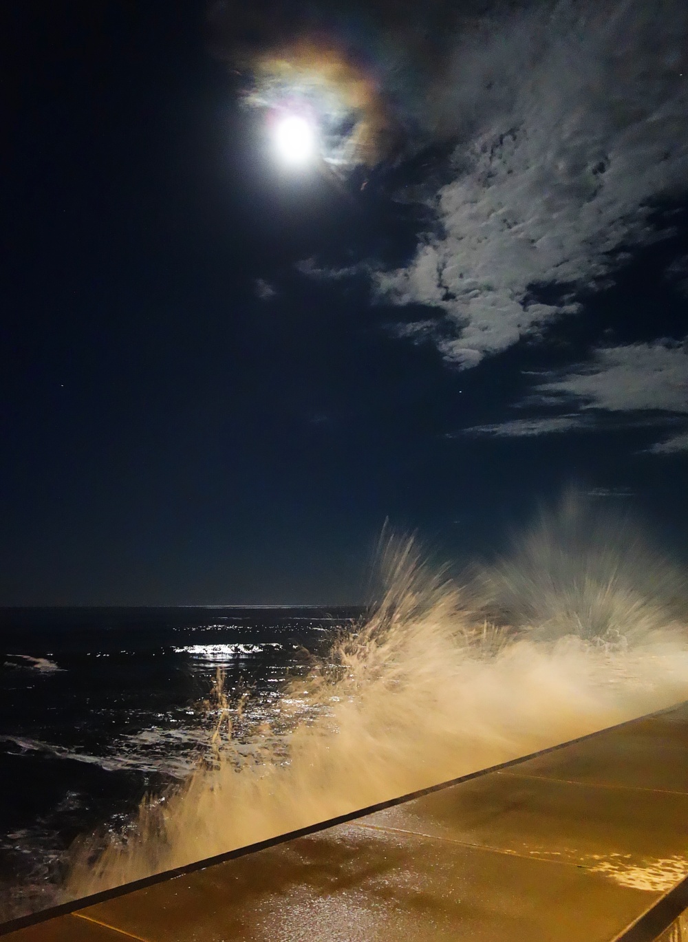 Crashing waves at night in York, Maine.