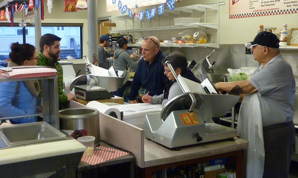 The Oliva family working at Oliva's Market in Milford, Mass.
